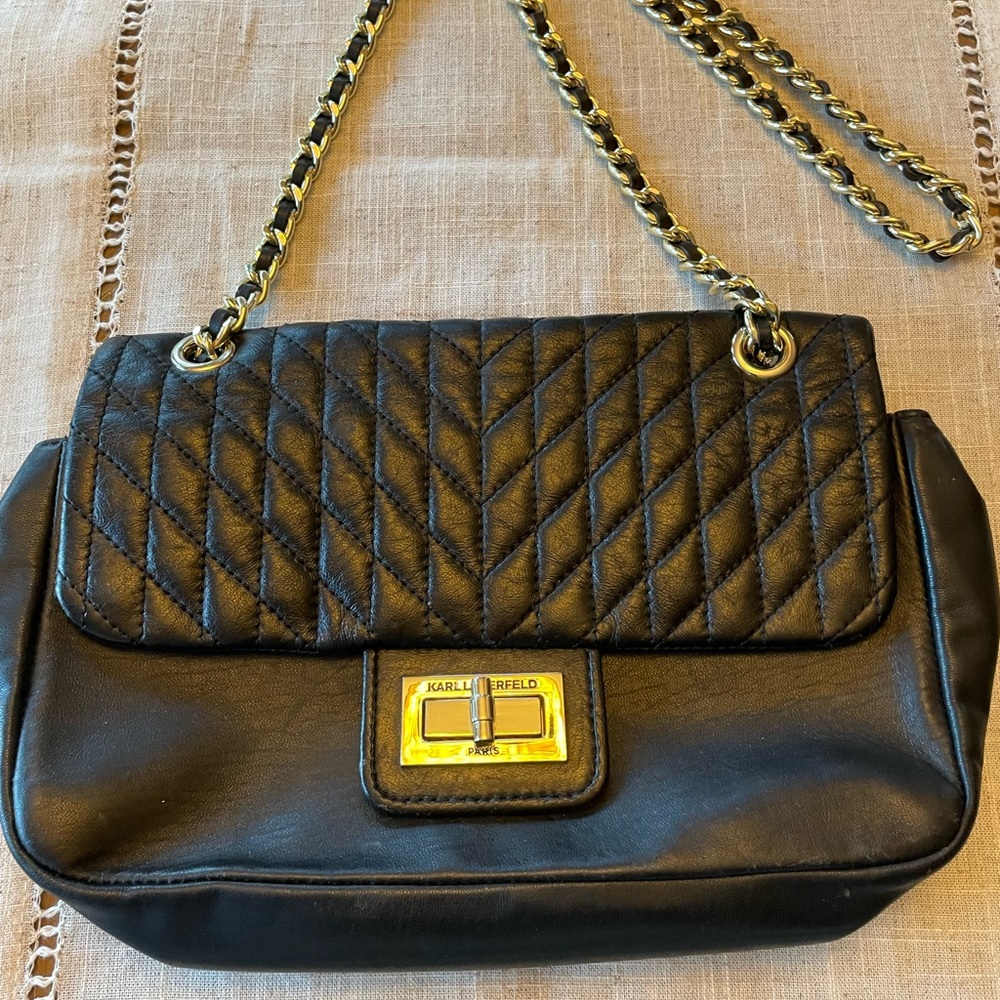 Women Handling Karl Lagerfeld (Paris) Black Color Gold Chain in Excellent shapes